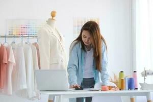 Fashion designer working in studio photo