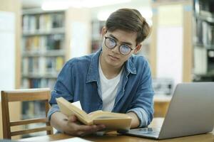 Student studying at library. photo