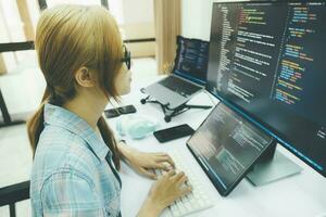 Programmer is coding and programming software. photo