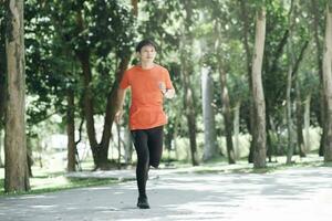 Athletic young man running photo