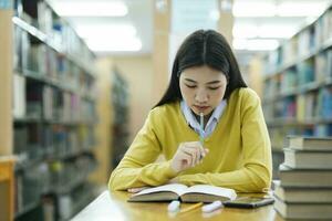 Student studying at library. photo