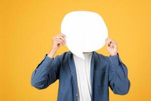 Asian man holding speech bubble. photo