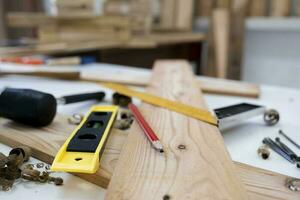 Close up of wood shavings on the carpenter's workbench. photo