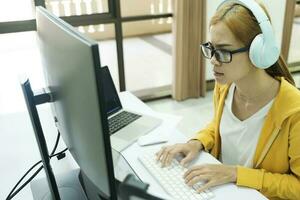 Young woman covering her face with both hands with the stress of work. photo