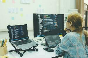 Programmer is coding and programming software. photo