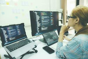 Programmer is coding and programming software. photo
