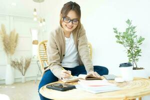 Young collage student reading a book sitting in a chair. photo