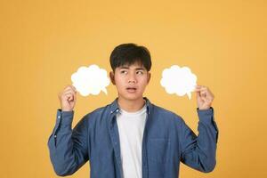 Asian man holding speech bubble. photo