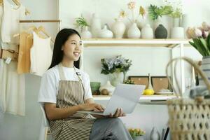 Young businessowner excited feel ecstatic reading great online news on laptop. photo