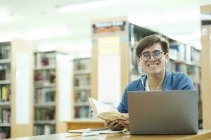 Student studying at library. photo