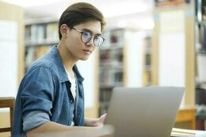 Student studying at library. photo