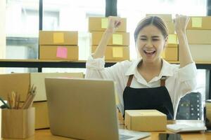 Asian businesswoman happy Home delivery service and working service mind. photo