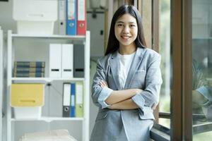 Portrait of confident woman arms crossed smiling at camera. photo