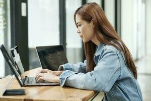 Young programmer or IT specialist satisfied with her work done. photo