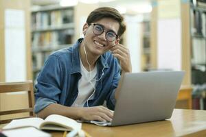 Student studying at library. photo