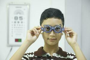 Man examining eyesight in optical clinic. photo