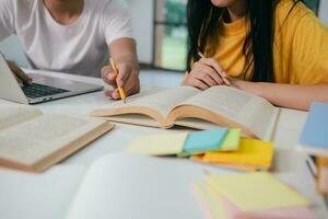 Young students campus helps friend catching up and learning. photo