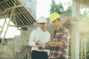 The engineering team working at building site meeting and discussing. photo