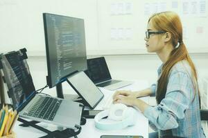 Programmer is coding and programming software. photo