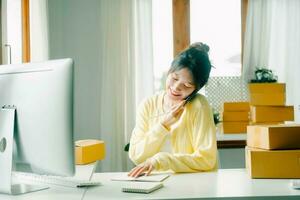 Young Asian businesswoman working talking. photo