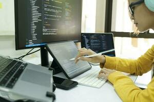 Programmer is coding and programming software. photo