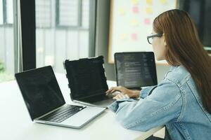 Young programmer or IT specialist satisfied with her work done. photo