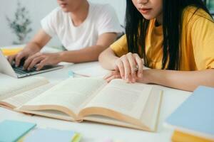 Young students campus helps friend catching up and learning. photo