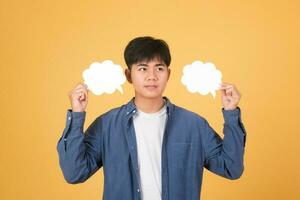 Asian man holding speech bubble. photo