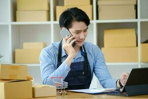 Asian business owner always keep contact with customer. photo