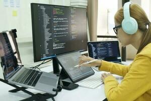 Programmer is coding and programming software. photo