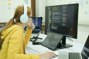 Programmer is coding and programming software. photo