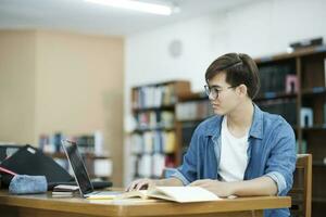 Student studying at library. photo