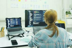 Programmer is coding and programming software. photo