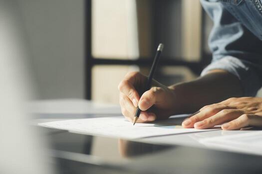 Close up of businessman working at office using laptop. photo