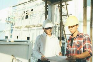 The engineering team working at building site meeting and discussing. photo