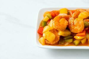 Stir-fried sweet and sour with fried shrimp photo