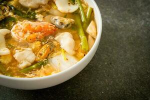 Sukiyaki soup with seafood bowl photo