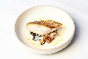 grilled Barramundi steak with mushroom sauce photo