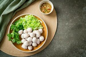 pork meatball with vegetable and spicy sauce photo