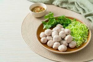 pork meatball with vegetable and spicy sauce photo