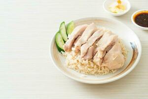 Hainanese chicken rice or rice steamed with chicken soup photo