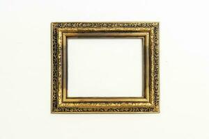 empty picture frame on white wall background photo