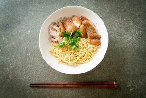 dried stewed pork leg noodles bowl photo