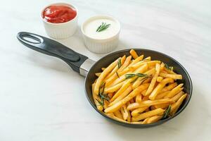 French fries with sour cream and ketchup photo