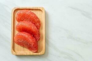 fresh red pomelo fruit or grapefruit photo