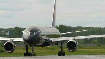 NOVOSIBIRSK, RUSSIAN FEDERATION JULY 15, 2022 - Jet passenger airplane of Azur Air with Lujo Art Joy Livery turning to the runway before take off. Tourism and travel concept video