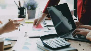 Financial analysts analyze business financial reports on a digital tablet planning investment project during a discussion at a meeting of corporate showing the results of their successful teamwork. video