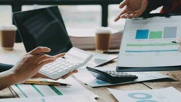 Financial analysts analyze business financial reports on a digital tablet planning investment project during a discussion at a meeting of corporate showing the results of their successful teamwork. video