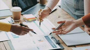 Financial analysts analyze business financial reports on a digital tablet planning investment project during a discussion at a meeting of corporate showing the results of their successful teamwork. video
