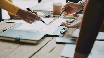 Financial analysts analyze business financial reports on a digital tablet planning investment project during a discussion at a meeting of corporate showing the results of their successful teamwork. video